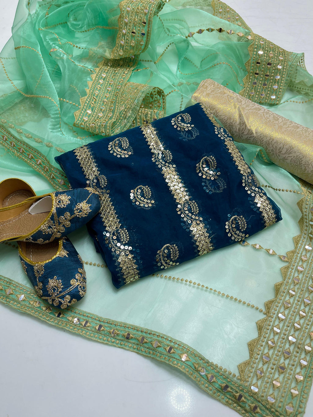 Organza embroidery front back same shirt 
Tissue beautiful embroidery work duppata 
Jamawar banarsi trouser 
With khusa